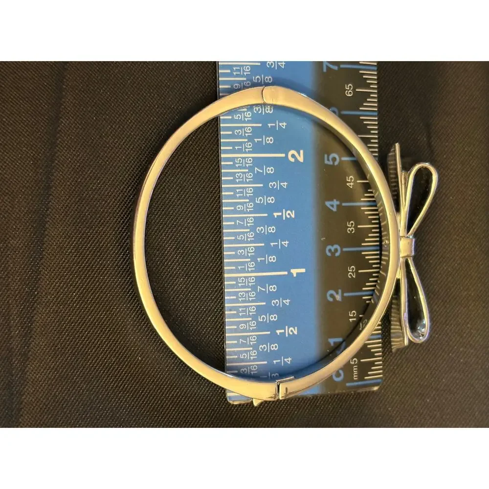 Kate Spade Silver Tone Bow Hinged Bangle Size 7